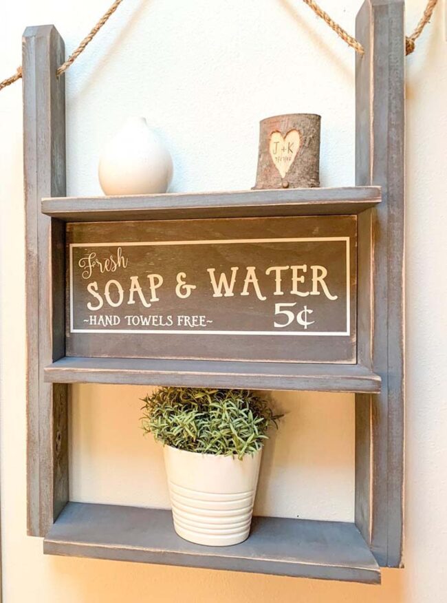 Weathered Ladder Shelves Maximize Bathroom Space