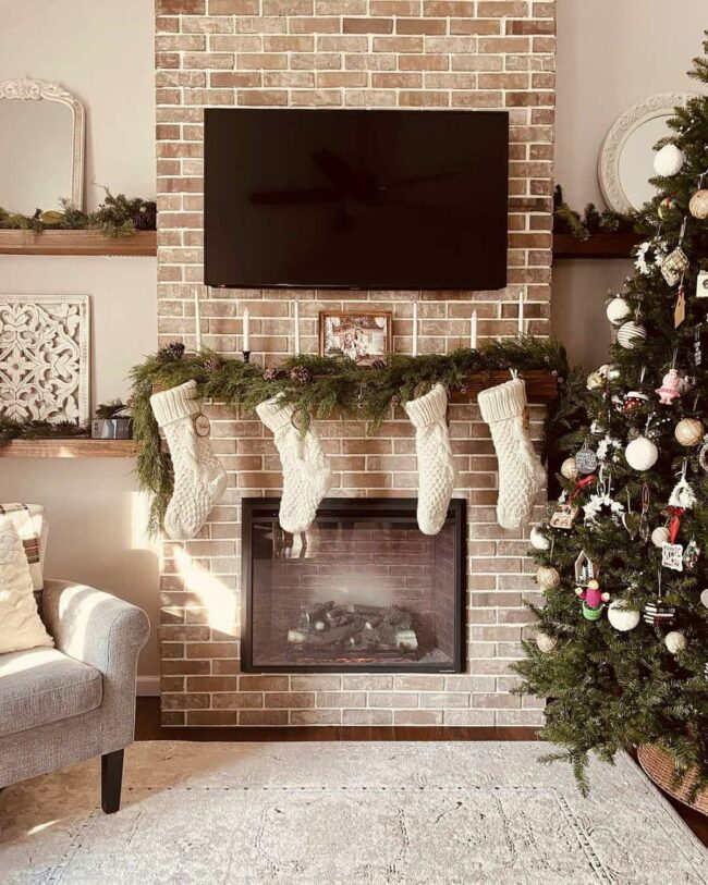 White Stockings Drape Pine Holiday Mantel