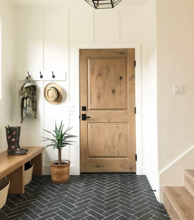 Pink Paneled Entryway with Black Accents