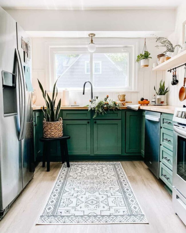 Verdant Green Cabinets Embrace Compact Kitchen