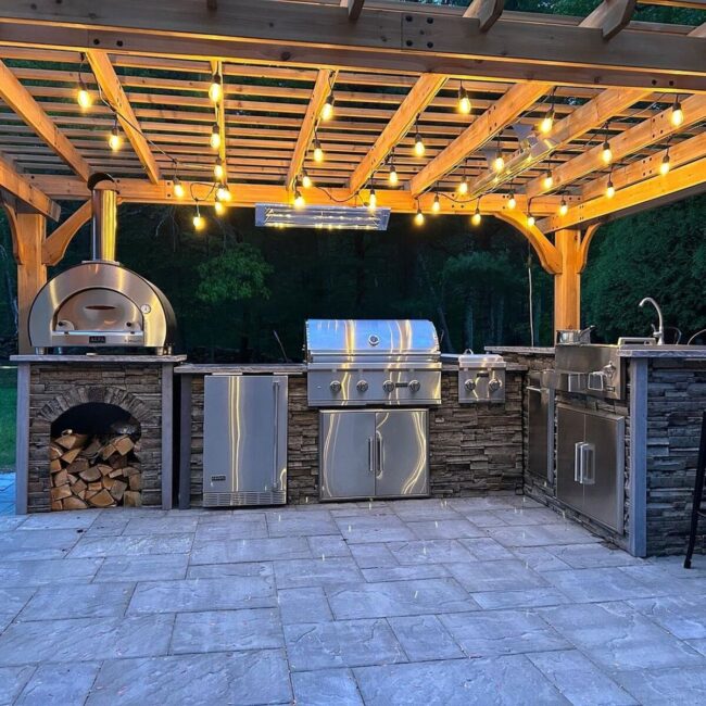 Steel Kitchen Under Wooden Pergola