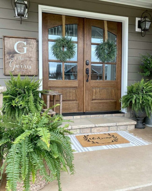 Green Wreaths Embrace Wooden Doorway Charm