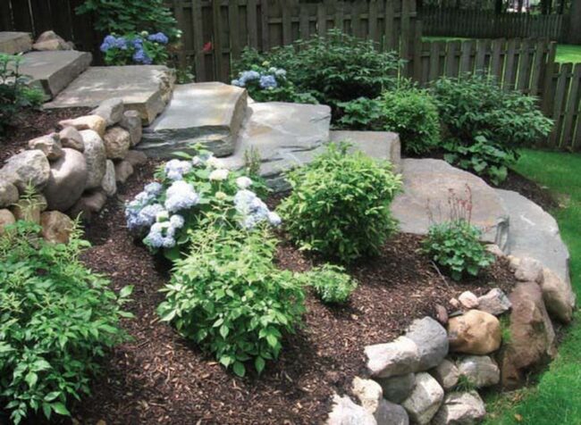 Stone-Framed Gardens Brown Mulch Sanctuary