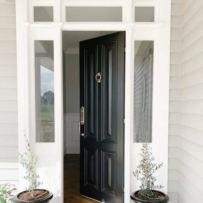 Brass Bold Black Door Entrance
