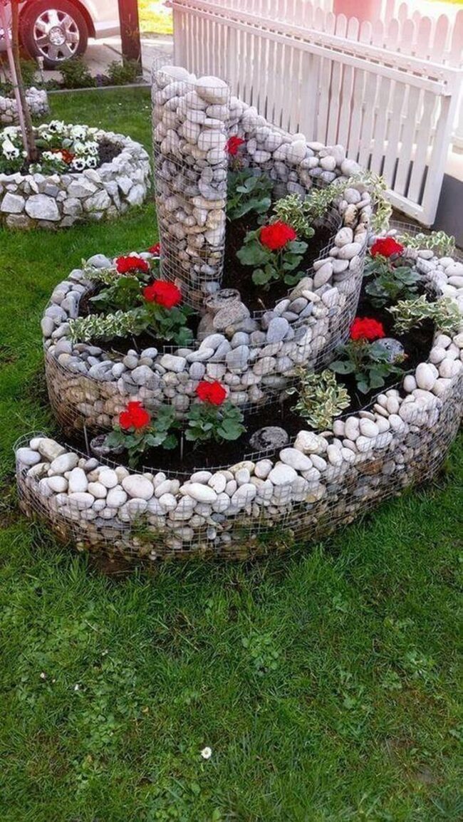 Red Roses Spiral Through Stone Waves