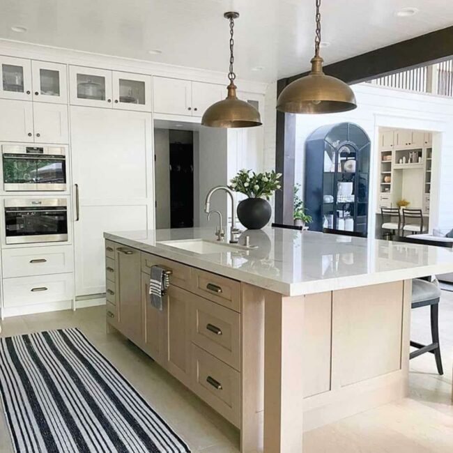 Brass Pendants Anchoring Neutral Kitchen