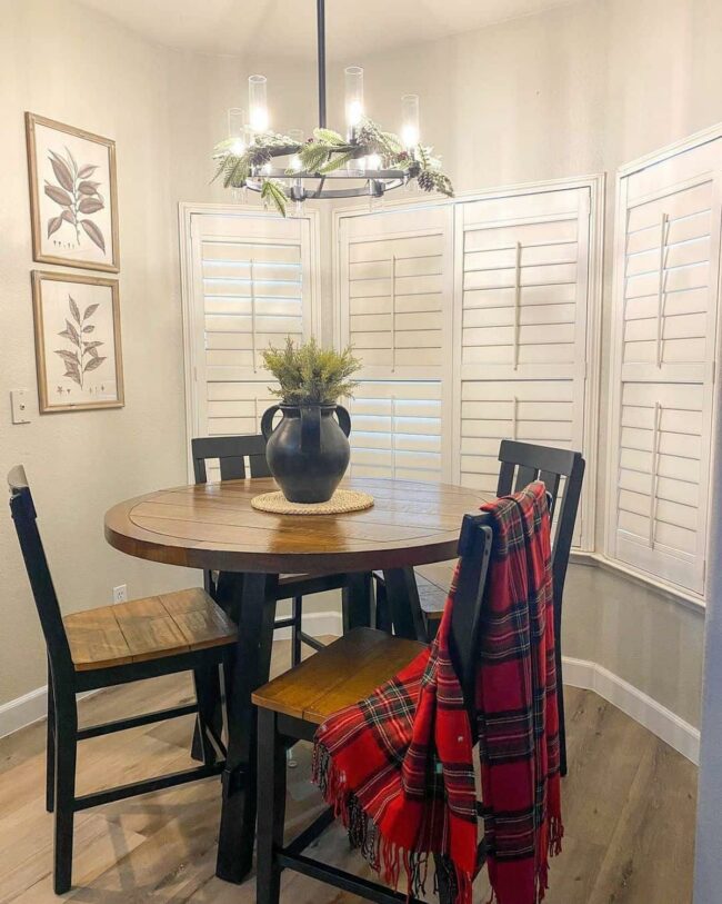 Black Wagon Wheel Chandelier Illuminates Space