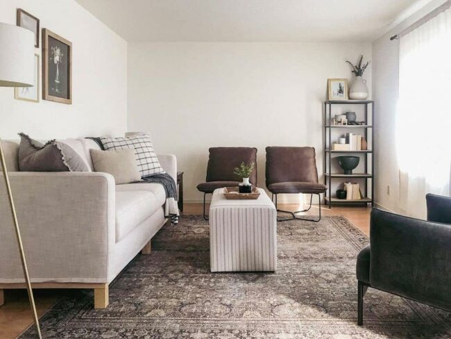 Checkered Pillow Meets Pinstripe Ottoman Charm