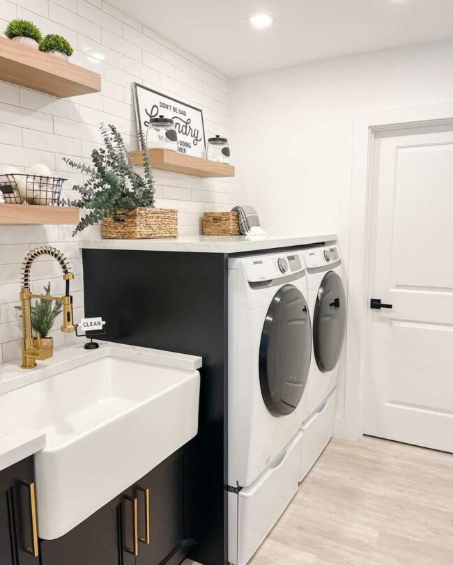Gold Spring Faucet Meets Black Cabinets