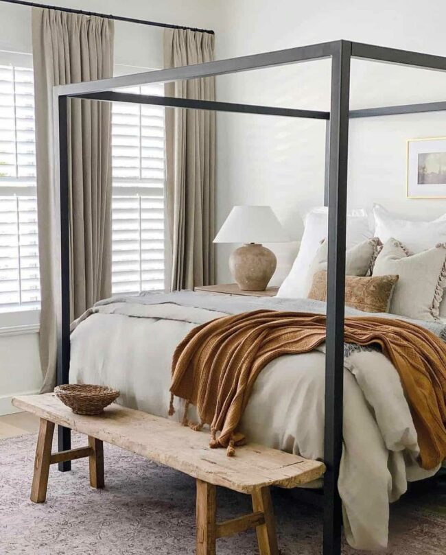 Black Canopy Bed Meets Wooden Charm
