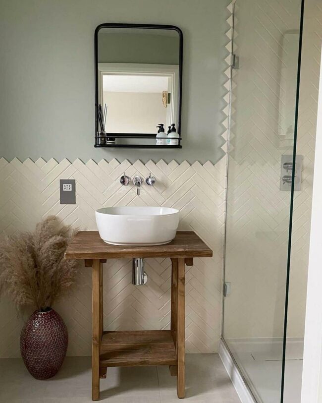 Ivory Herringbone Tiles Elevate Bathroom
