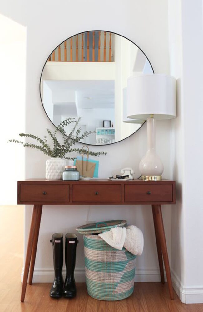 Round Mirror Expands Compact Entryway