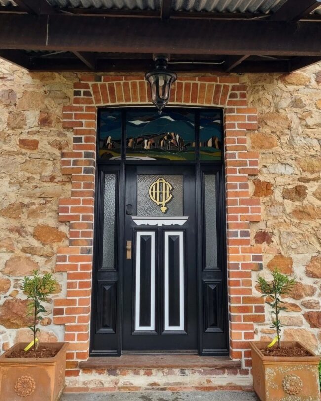 Decorative Window on Vintage Black Door